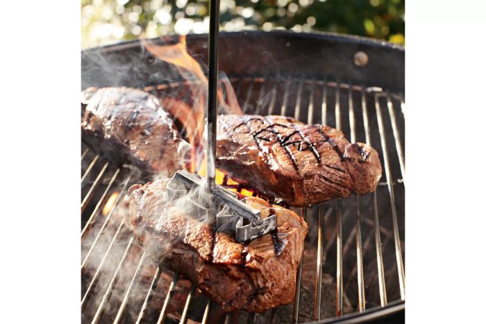 Steak being branded with the Williams Sonoma Monogrammed Forged Steak Brand