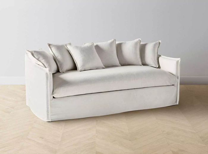 Dune Sofa showcased on a wooden floor