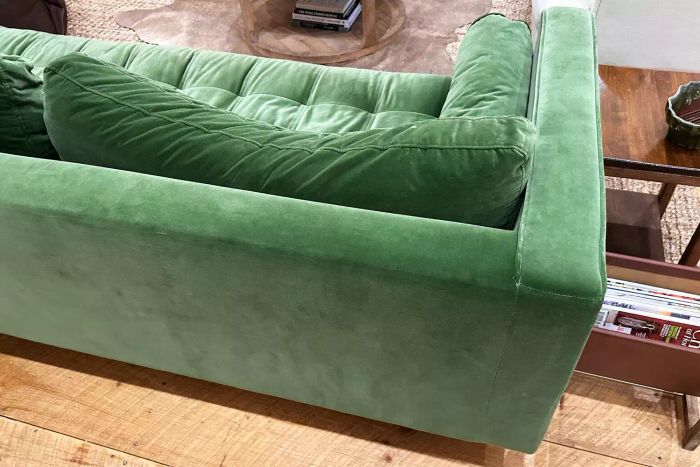 The rear view of the green Article Sven Sofa