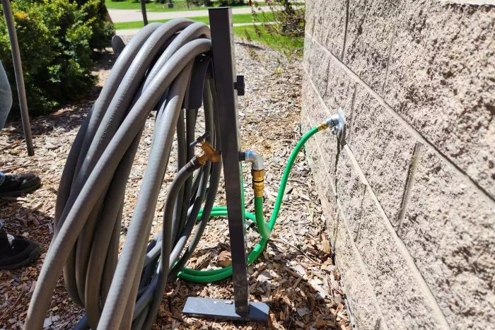 Side view of the AQUA JOE 125 ft. Capacity Garden Hose Stand with Brass Faucet