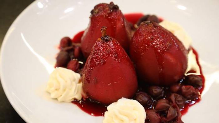 Cranberry-infused poached pears in red wine served with mascarpone.