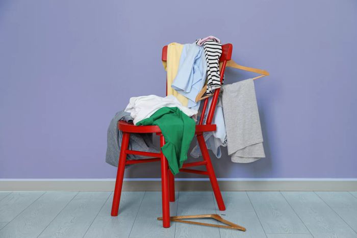 chair piled with clothes