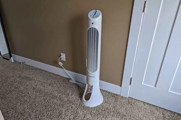 The Honeywell QuietSet Whole Room Tower Fan connected to a wall outlet