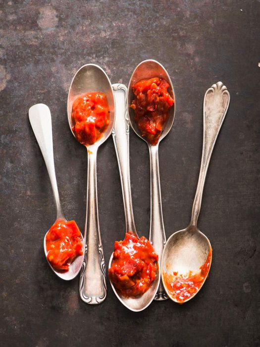 Sambal sauce served on spoons.