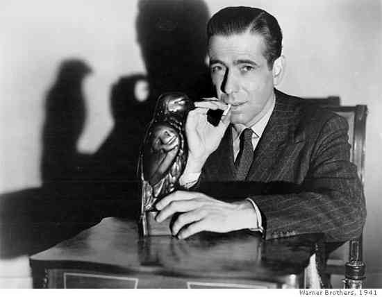 Sam Spade, the hardboiled detective first introduced by Dashiell Hammett, stands as a key figure in detective fiction. Appearing primarily in ‘The Maltese Falcon’ (1930), Spade, the head of a detective agency in San Francisco, is noted for his courage and willingness to get his hands dirty in both physical and moral confrontations. He’s often seen as cynical but upholds a strong moral code. Although he only appears in one full novel and three short stories, Spade’s influence on subsequent characters in the genre, including Chandler’s Philip Marlowe, is profound. Humphrey Bogart immortalized him in the 1941 movie version of ‘The Maltese Falcon.’