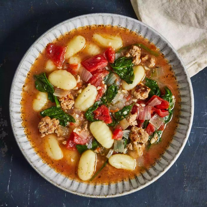 Gnocchi and sausage soup served in a bowl