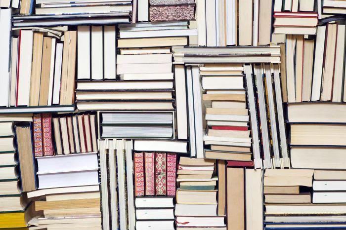 A stack of books piled one on top of another