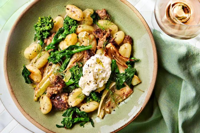 Gnocchi sautéed with sausage and broccoli rabe—savory, hearty, and satisfying—make a perfect pairing for pillowy gnocchi that cook quickly, bringing everything together in a delightful dish.