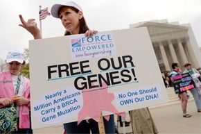 A woman holding a sign that reads 
