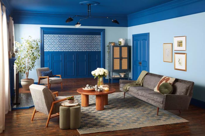 A living room adorned with a rich shade of blue paint.