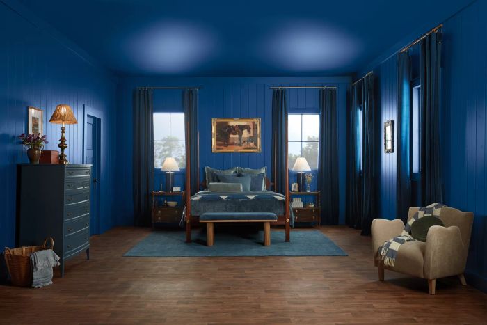A bedroom painted in shades of blue.