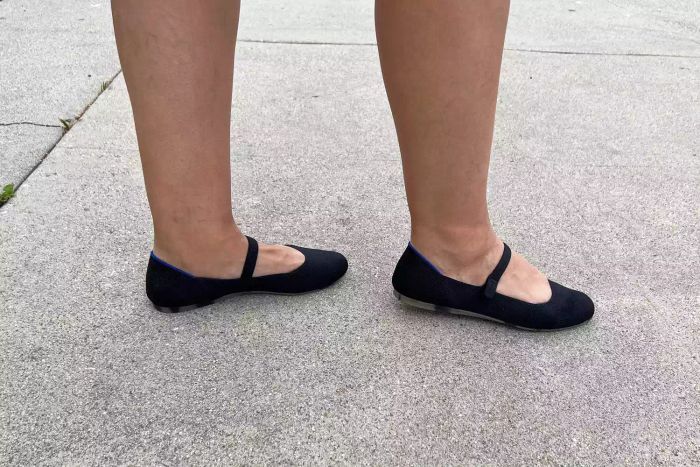 A person wearing Rothy's The Square Mary Janes