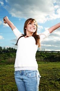 A joyful girl with her arms outstretched