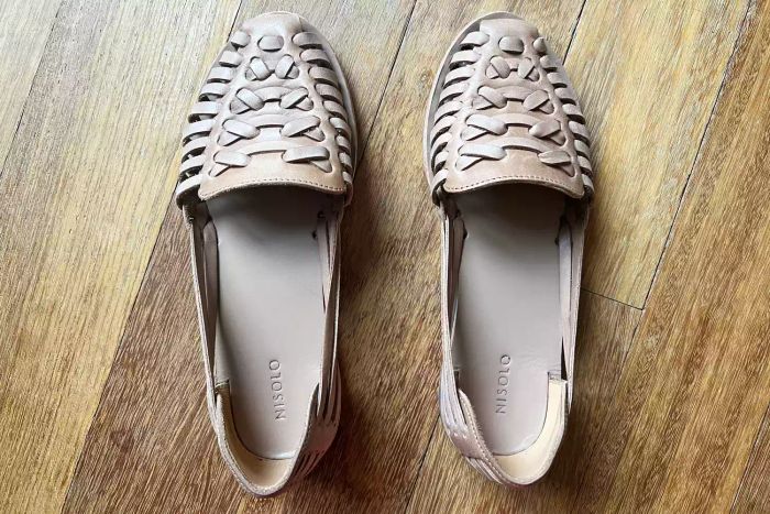 Nisolo Huarache Sandals placed on a wooden floor