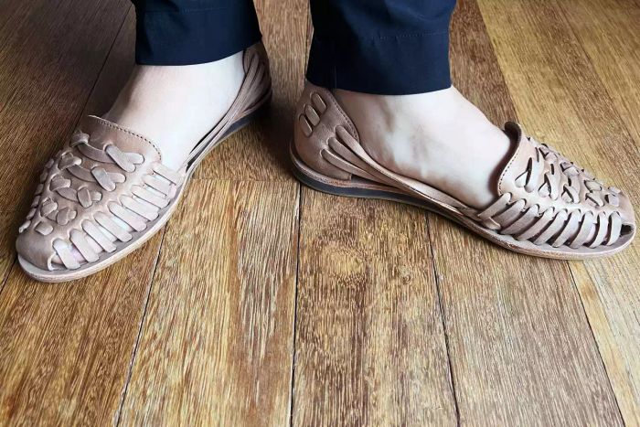 A person wearing Nisolo Huarache Sandals