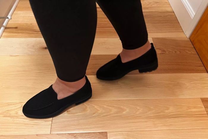 A person wearing Rothy's The Lug Loafers inside