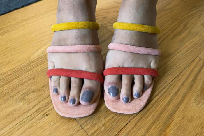 A close-up view of someone wearing the Charlotte Stone Belle heels