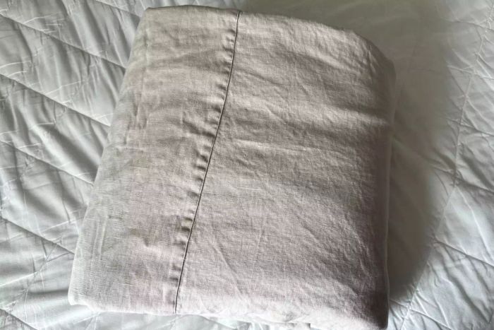 A display of the folded Rough Linen Smooth Linen Sheet Set