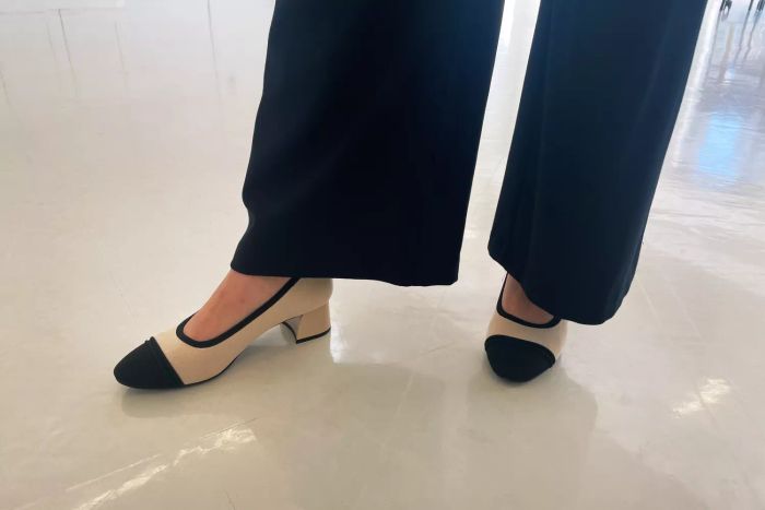 A model wearing pants paired with the Vivaia Round-Toe Chunky Heels (Julie Pro)