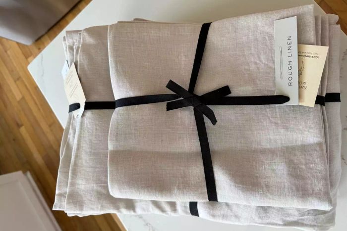 A display of the folded Rough Linen Smooth Linen Sheet Set