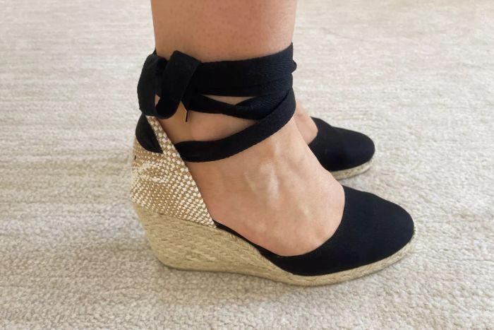 A close-up view of the Castañer Carina Wedge Espadrilles on someone’s feet