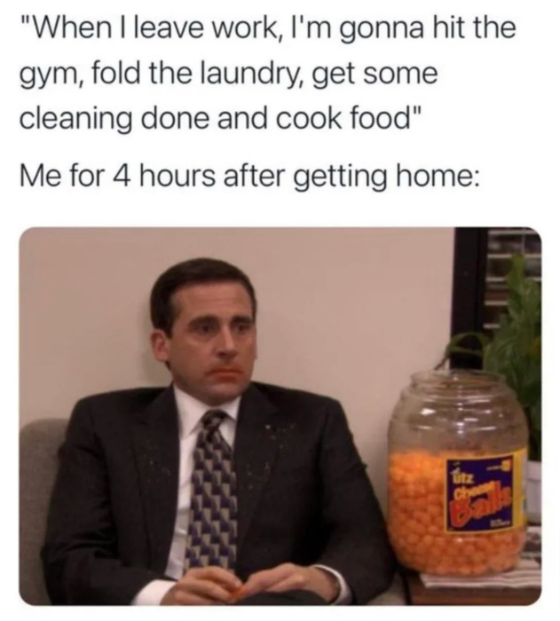Michael Scott holding a tub of cheese balls