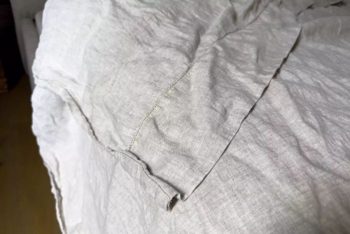 Pottery Barn Belgian Flax Linen Sheet Set arranged on a bed