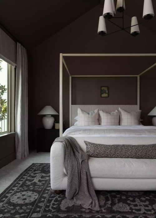A bedroom featuring brown tones