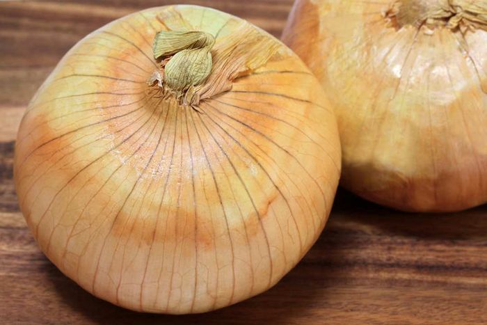 Sweet onions placed on a table.