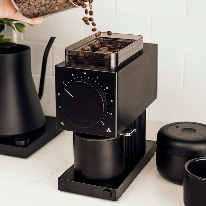 The Fellow Ode Brew Grinder filled with freshly poured coffee beans.