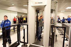 A visual showing a man undergoing a scan with a millimeter wave scanner.