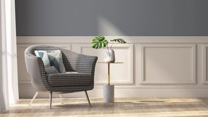 Beige wainscoting wall paneling with gray paint above
