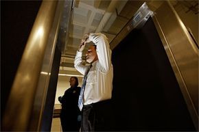 A volunteer being scanned by a backscatter scanner.