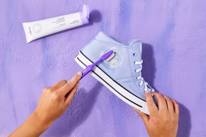 cleaning Converse with a toothbrush