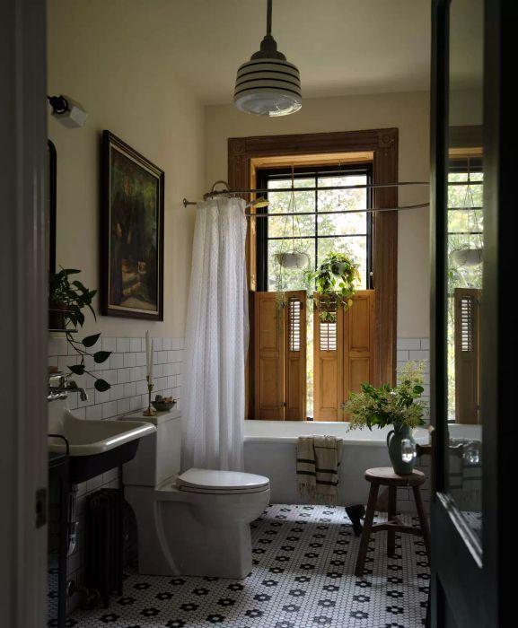 bathroom with plants and painting