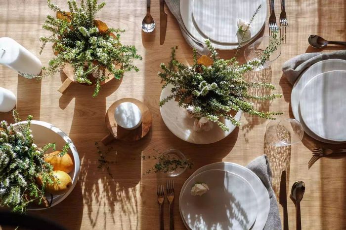 A tablescape featuring aromatic herbs