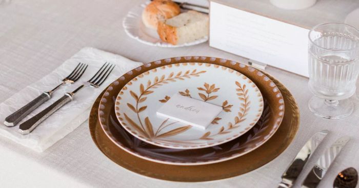 A wedding reception tablescape complete with plates