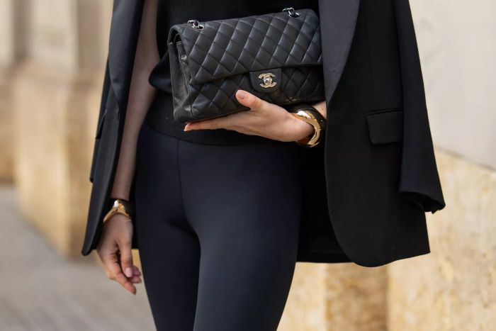 woman wearing leggings paired with a stylish jacket