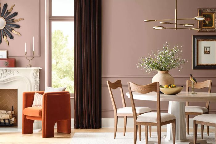 The living and dining spaces bathed in a delicate mauve-pink hue
