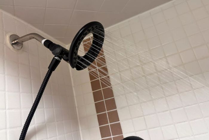 A halo component of the Delta Faucet 4-Setting In2ition 2-in-1 Dual Shower Head 75486CSN activated in a shower