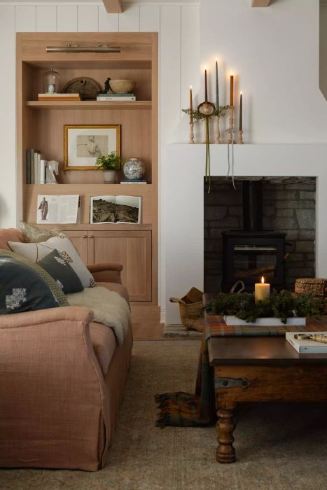 a living room featuring candles on the mantel