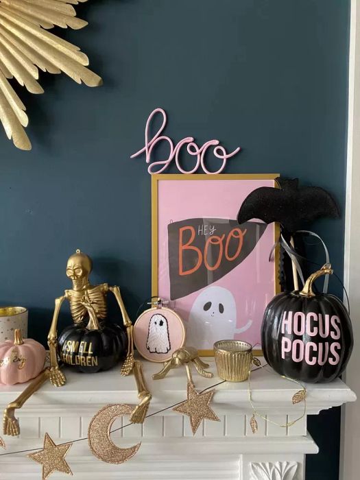 mantel adorned with Halloween-themed decorations