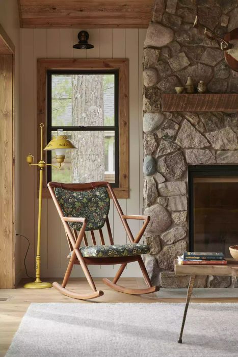 a stone fireplace mantel featuring antlers