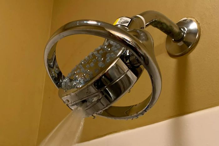Water flowing from the side nozzle of the Kohler K-15996-CP Flipside Showerhead