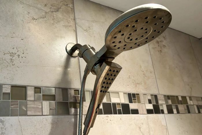 The Moen Verso Shower with Infiniti Dial installed in a tiled shower