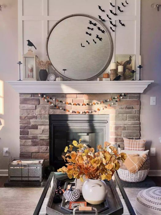 autumn fireplace decor featuring bat silhouettes