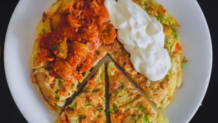 Beneath all those eggs, you'll find crispy fries.