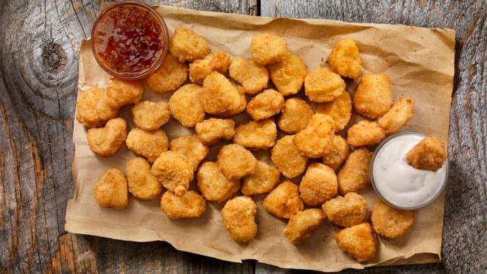 While McDonald's popularized chicken nuggets globally, their origins trace back to a pioneering professor in poultry and food science at Cornell University.