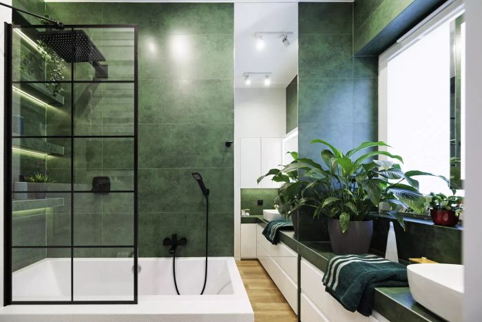 Modern luxury bathroom featuring green and white tiles