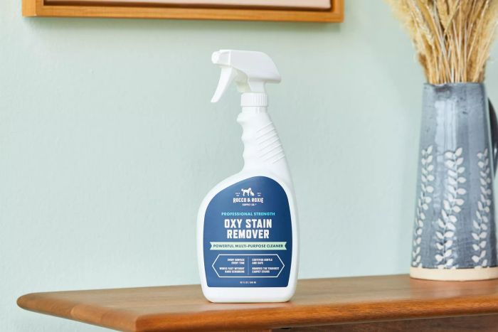 Rocco & Roxie Supply Co. Oxy Stain Remover placed on a wooden table for display.
